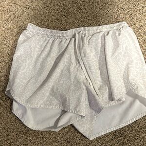 White/gray leopard print athletic shorts